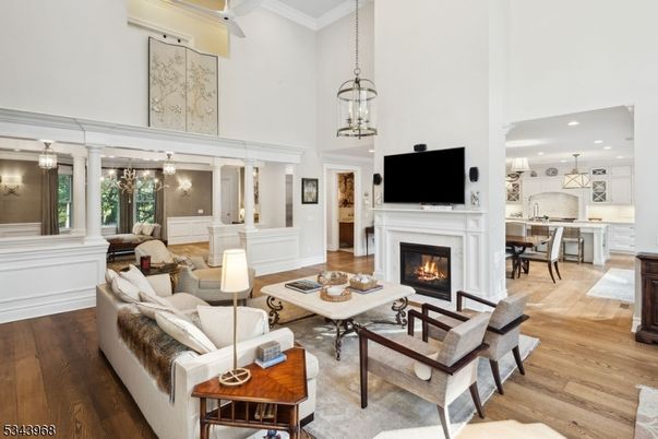 Chandelier, Dining room, Fireplace, Interior, Kitchen, Living room, Pendant Lights, Recessed Lighting, Wood Texture Flooring