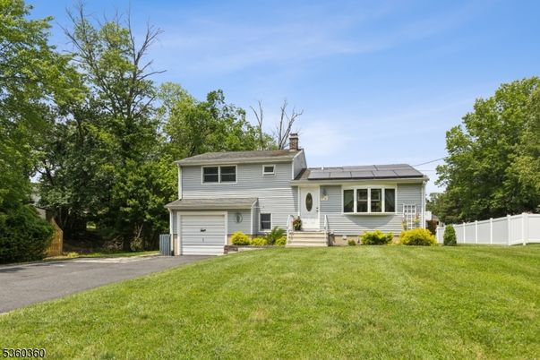 Attached, Backyard, Exterior, Facade, Solar Panels, Split Level