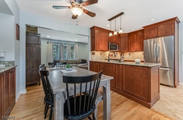 Dining room, Interior, Kitchen, Living room, Pendant Lights, Recessed Lighting, Stainless Steel Appliances, Wood Texture Flooring