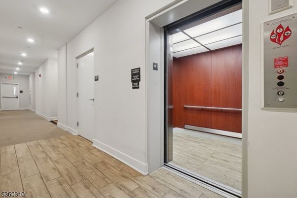 Elevator, Interior, Recessed Lighting, Wood Texture Flooring, Wooden Walls