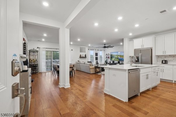 Dining room, Interior, Kitchen, Living room, Recessed Lighting, Stainless Steel Appliances, Wood Texture Flooring