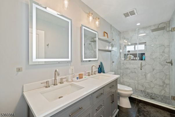 Bathroom, Dual Sink Vanities, Glass Shower, Interior, Marble Walls, Recessed Lighting