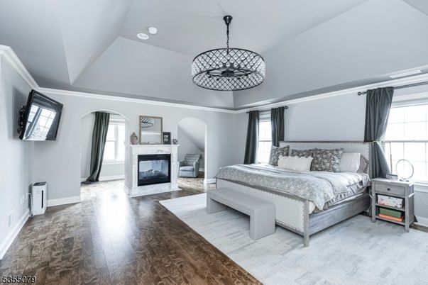 Bedroom, Fireplace, Interior, Pendant Lights, Recessed Lighting, Wood Texture Flooring