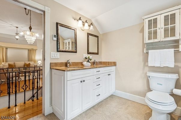 Bathroom, Chandelier, Dual Sink Vanities, Interior, Wood Texture Flooring