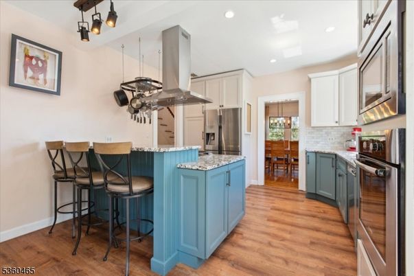 Dining room, Interior, Kitchen, Recessed Lighting, Stainless Steel Appliances, Wood Texture Flooring