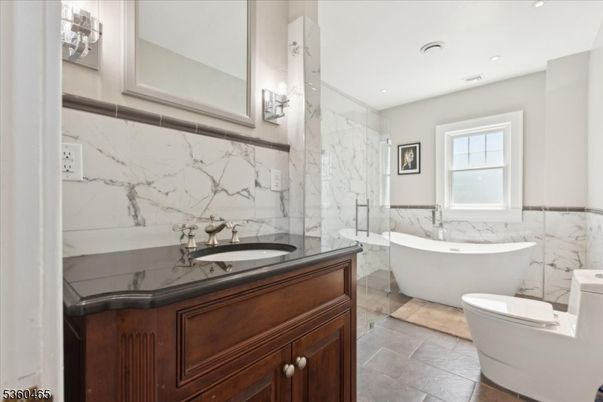Bathroom, Free Standing Baths, Glass Shower, Interior, Marble Walls, Recessed Lighting