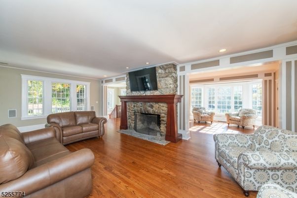 Fireplace, Interior, Living room, Recessed Lighting, Stone Walls, Wood Texture Flooring