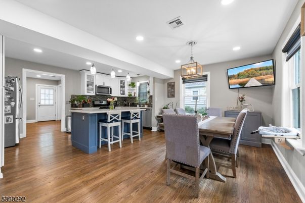 Dining room, Interior, Kitchen, Pendant Lights, Recessed Lighting, Stainless Steel Appliances, Wood Texture Flooring