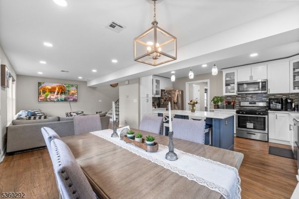 Dining room, Interior, Kitchen, Living room, Pendant Lights, Recessed Lighting, Stainless Steel Appliances, Wood Texture Flooring