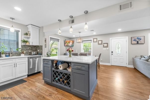 Dining room, Interior, Kitchen, Pendant Lights, Recessed Lighting, Stainless Steel Appliances, Wood Texture Flooring
