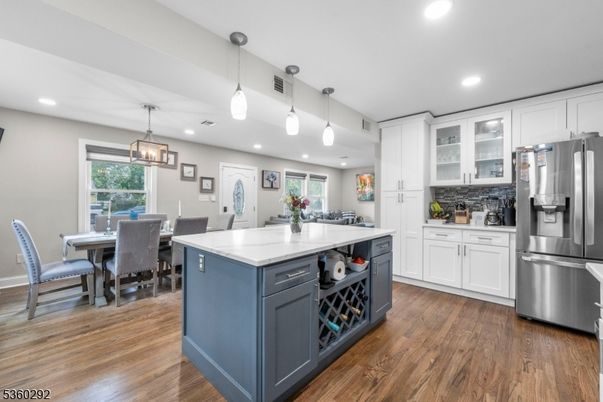 Dining room, Interior, Kitchen, Pendant Lights, Recessed Lighting, Stainless Steel Appliances, Wood Texture Flooring
