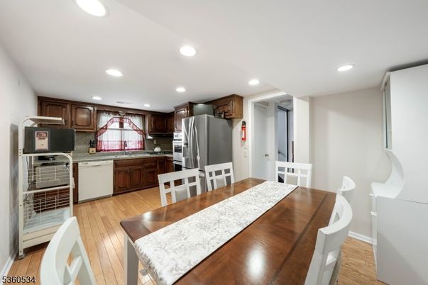Dining room, Interior, Kitchen, Recessed Lighting, Stainless Steel Appliances, Wood Texture Flooring