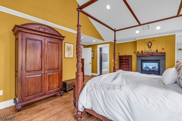 Bedroom, Fireplace, Interior, Recessed Lighting, Wood Texture Flooring