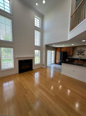 Empty room, Fireplace, Interior, Kitchen, Recessed Lighting, Wood Texture Flooring