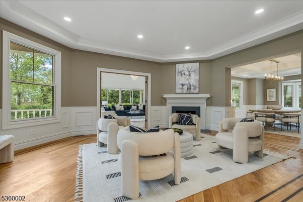 Chandelier, Dining room, Fireplace, Interior, Living room, Pendant Lights, Recessed Lighting, Wood Texture Flooring