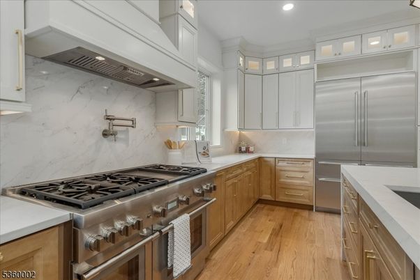 Interior, Kitchen, Marble Walls, Recessed Lighting, Stainless Steel Appliances, Wood Texture Flooring