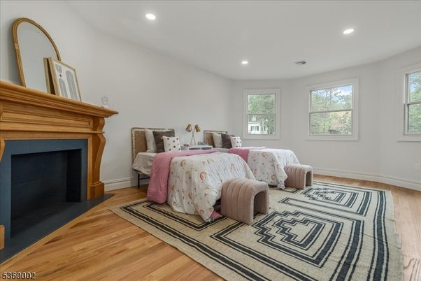 Bedroom, Fireplace, Interior, Recessed Lighting, Wood Texture Flooring