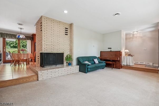 Dining room, Fireplace, Interior, Pendant Lights, Piano, Recessed Lighting, Stone Walls