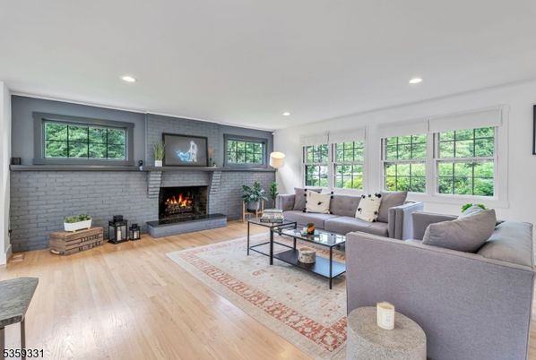 Fireplace, Interior, Living room, Recessed Lighting, Stone Walls, Wood Texture Flooring