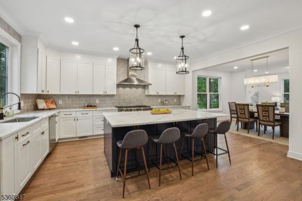 Chandelier, Dining room, Interior, Kitchen, Pendant Lights, Recessed Lighting, Stainless Steel Appliances, Wood Texture Flooring