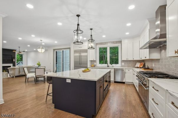 Dining room, Interior, Kitchen, Living room, Pendant Lights, Recessed Lighting, Stainless Steel Appliances, Wood Texture Flooring