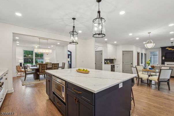 Chandelier, Dining room, Interior, Kitchen, Living room, Pendant Lights, Recessed Lighting, Wood Texture Flooring