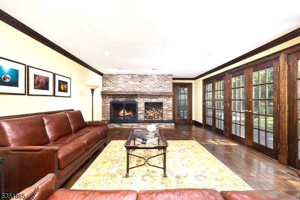 Fireplace, Interior, Living room, Recessed Lighting, Stone Walls, Wood Texture Flooring