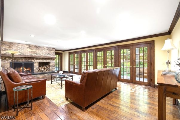 Fireplace, Interior, Living room, Recessed Lighting, Stone Walls, Wood Texture Flooring