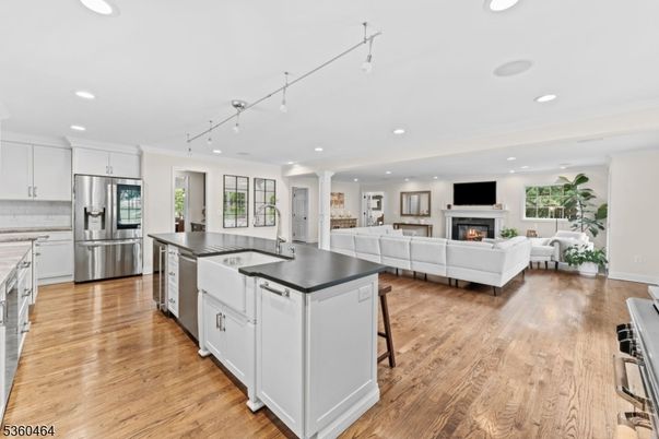 Fireplace, Interior, Kitchen, Living room, Recessed Lighting, Stainless Steel Appliances, Wood Texture Flooring