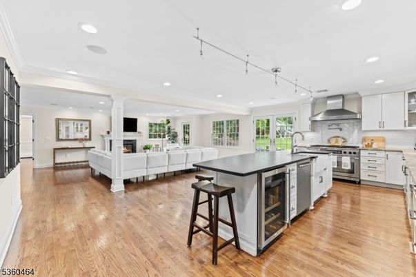 Fireplace, Interior, Kitchen, Living room, Recessed Lighting, Stainless Steel Appliances, Wood Texture Flooring