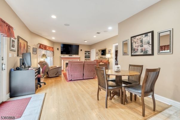 Dining room, Fireplace, Interior, Living room, Recessed Lighting, Wood Texture Flooring