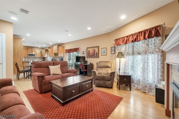 Dining room, Fireplace, Interior, Kitchen, Living room, Pendant Lights, Recessed Lighting, Stainless Steel Appliances, Wood Texture Flooring