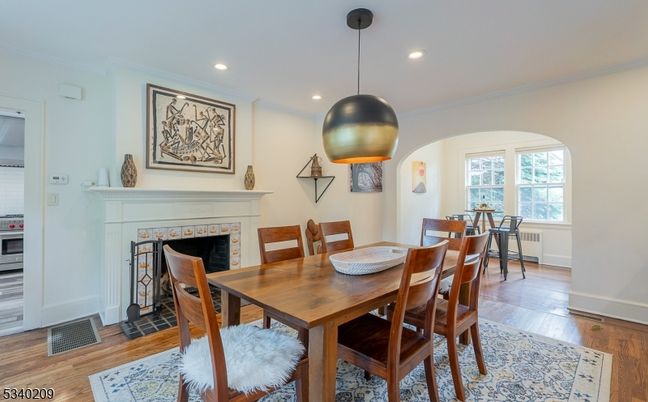 Dining room, Fireplace, Interior, Pendant Lights, Recessed Lighting, Wood Texture Flooring