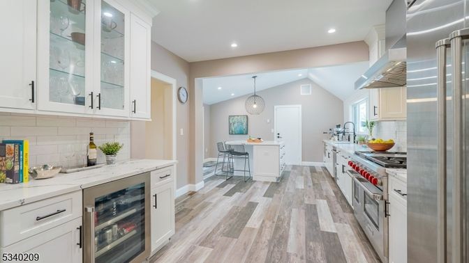 Dining room, Interior, Kitchen, Pendant Lights, Recessed Lighting, Stainless Steel Appliances, Wood Texture Flooring