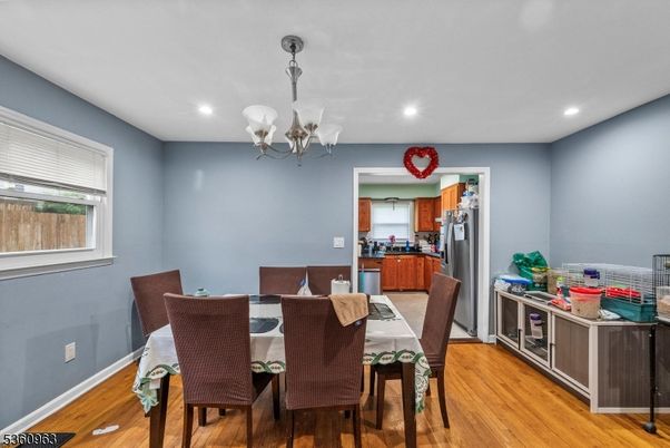 Chandelier, Dining room, Interior, Kitchen, Recessed Lighting, Stainless Steel Appliances, Wood Texture Flooring