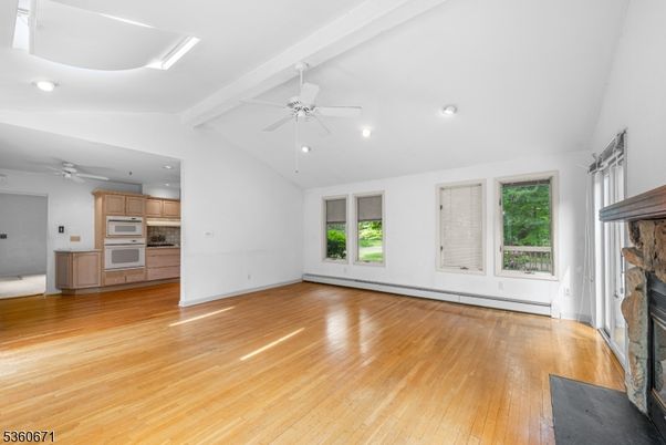 Empty room, Fireplace, Interior, Kitchen, Recessed Lighting, Wood Texture Flooring