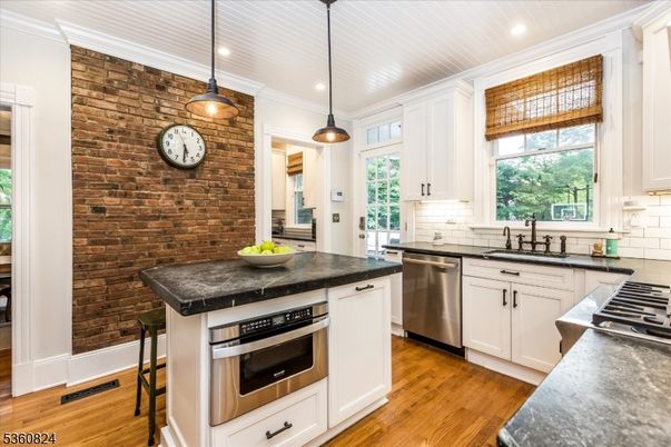 Interior, Kitchen, Pendant Lights, Recessed Lighting, Stainless Steel Appliances, Stone Walls, Wood Texture Flooring