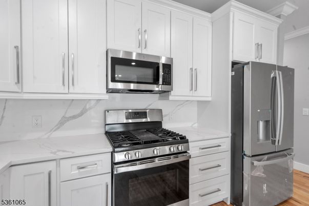 Interior, Kitchen, Marble Walls, Stainless Steel Appliances, Wood Texture Flooring