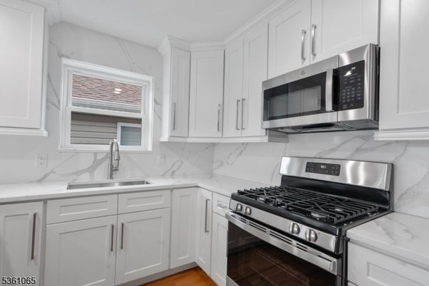 Interior, Kitchen, Marble Walls, Stainless Steel Appliances, Wood Texture Flooring