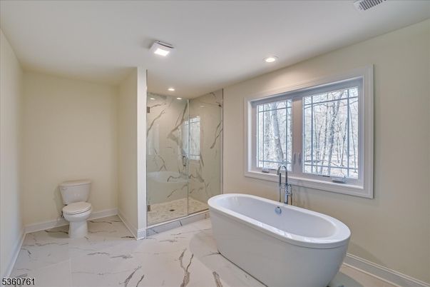 Bathroom, Free Standing Baths, Glass Shower, Interior, Marble, Marble Walls, Recessed Lighting