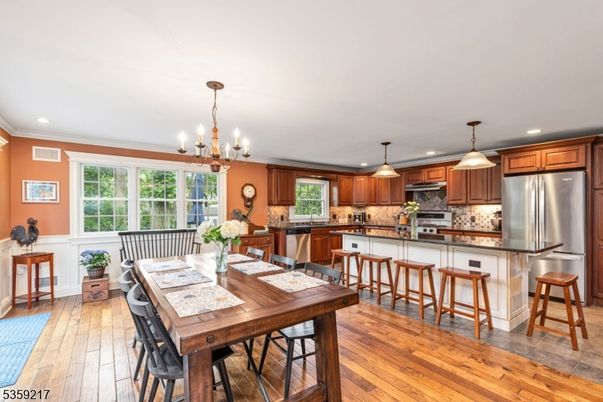 Chandelier, Dining room, Interior, Kitchen, Pendant Lights, Recessed Lighting, Stainless Steel Appliances, Wood Texture Flooring