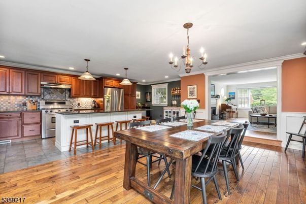 Chandelier, Dining room, Interior, Kitchen, Pendant Lights, Recessed Lighting, Stainless Steel Appliances, Wood Texture Flooring