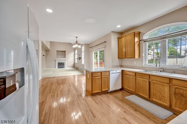 Chandelier, Fireplace, Interior, Kitchen, Pendant Lights, Recessed Lighting, Wood Texture Flooring