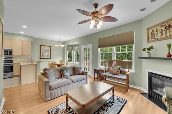 Chandelier, Dining room, Fireplace, Interior, Kitchen, Living room, Recessed Lighting, Wood Texture Flooring