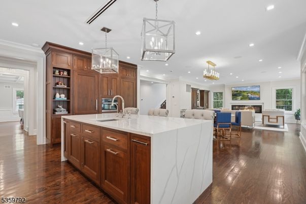 Chandelier, Dining room, Fireplace, Interior, Kitchen, Living room, Pendant Lights, Recessed Lighting, Wood Texture Flooring