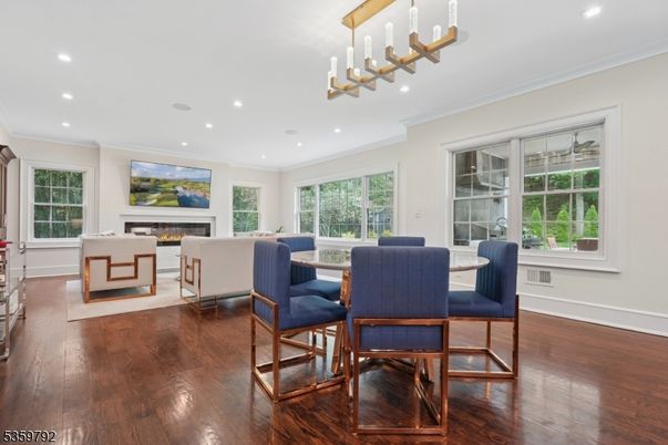 Dining room, Fireplace, Interior, Living room, Pendant Lights, Recessed Lighting, Wood Texture Flooring
