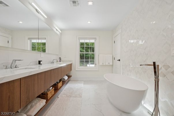 Bathroom, Dual Sink Vanities, Free Standing Baths, Interior, Marble, Marble Walls, Recessed Lighting
