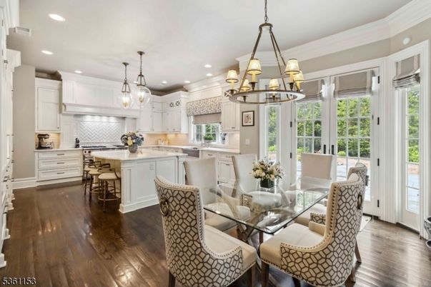 Chandelier, Dining room, Interior, Kitchen, Pendant Lights, Recessed Lighting, Stainless Steel Appliances, Wood Texture Flooring