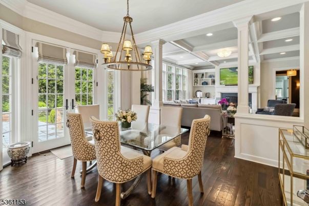 Chandelier, Dining room, Fireplace, Interior, Living room, Pendant Lights, Recessed Lighting, Wood Texture Flooring