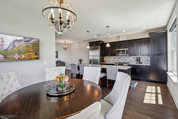 Chandelier, Dining room, Interior, Kitchen, Pendant Lights, Recessed Lighting, Stainless Steel Appliances, Wood Texture Flooring